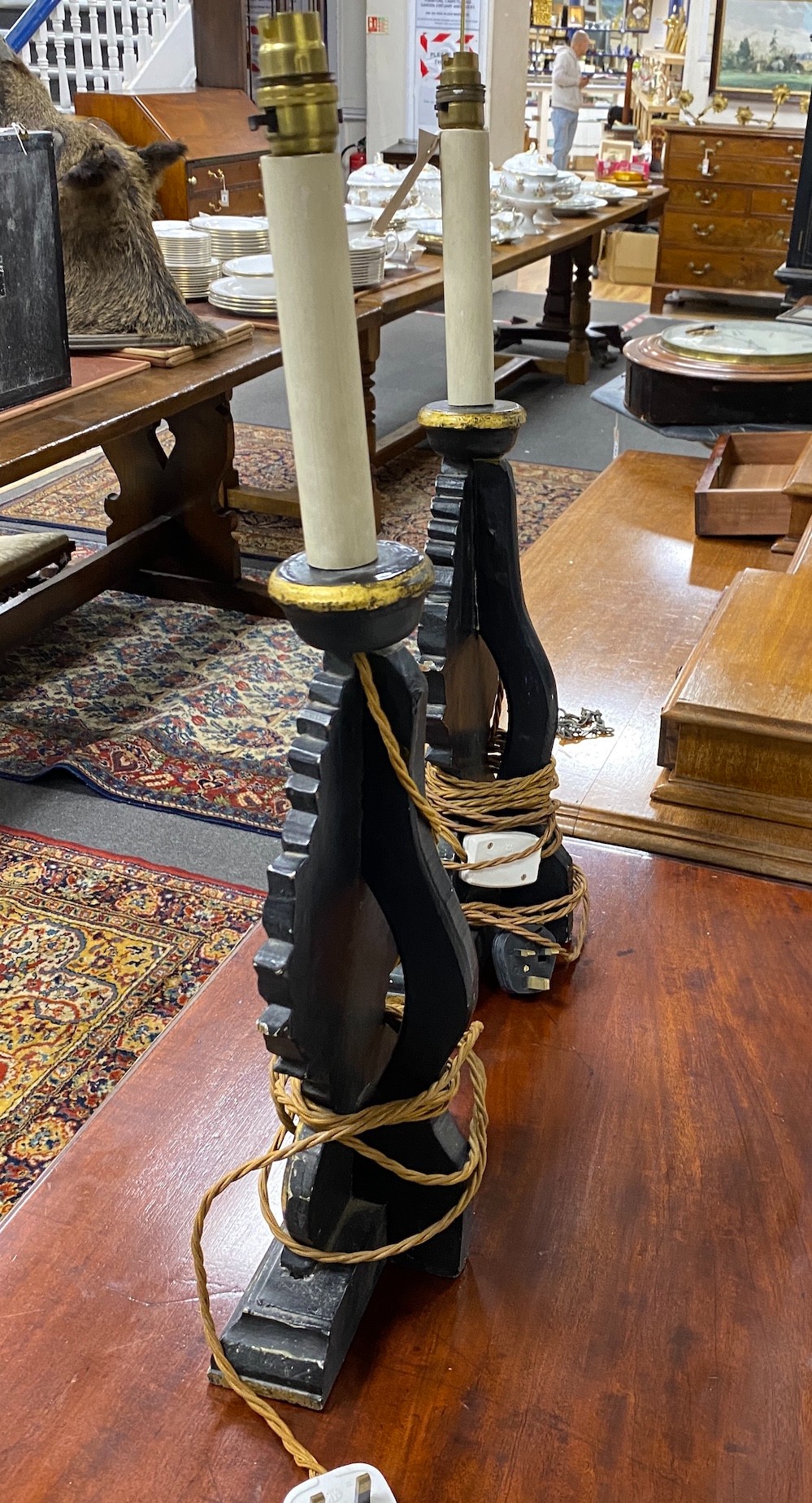 A pair of 18th century style painted parcel gilt table lamps, height 63cm